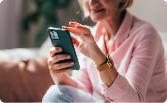Woman setting daily reminders on phone.